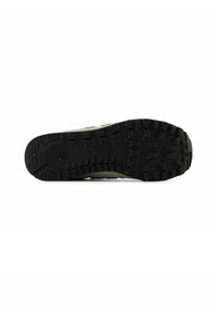 Sneakersole in zwart rubber met een gestructureerd loopvlak; groene bovenkant zichtbaar aan de randen; met spikkels voor extra detail.