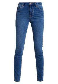 Jeans ajustados de denim azul, con cintura alta, cinco bolsillos y un cierre de botón clásico. Textura suave con un desgaste mínimo.