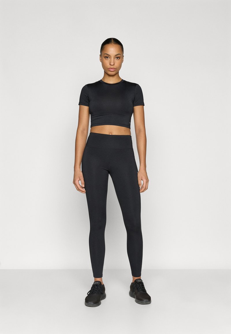 Black cropped athletic top and high-waisted leggings, both in a sleek, fitted design. Textured fabric with no visible patterns or accents.