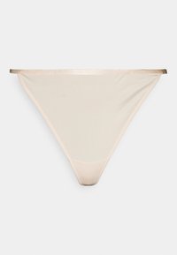 Fio dental bege transparente com uma textura suave, apresentando uma faixa metálica fina e um design minimalista para uma cobertura discreta.