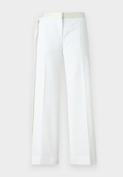 White wide-leg trousers made of smooth fabric, featuring a flat front, pockets, and a pale green satin waistband with tie detail.
