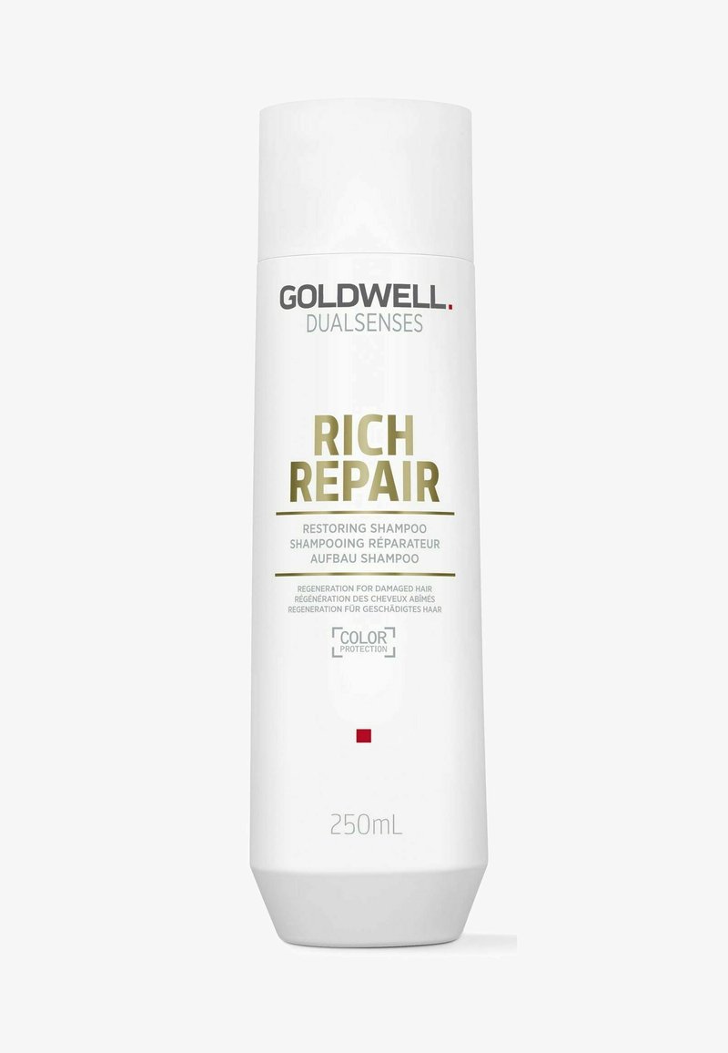 Goldwell Dualsenses Rich Repair shampoo in a white plastic bottle, featuring a gold logo, text, and a tapered base with a red accent. 250ml.