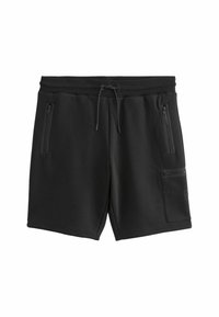 Shorts noirs en matière douce et extensible, avec une ceinture côtelée, un cordon de serrage ajustable et plusieurs poches zippées.