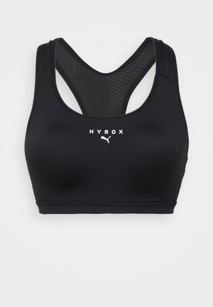 Top sportivo nero con scollatura a V, dotato di schiena in rete e logo "HYROX" bianco. Realizzato in tessuto elegante e elasticizzato per abbigliamento atletico.