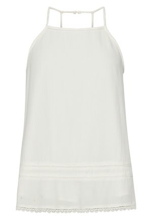 Kobieta z kręconymi włosami, ubrana w biały bezrękawnik typu halter, pokazana od tyłu na jednolitym tle.