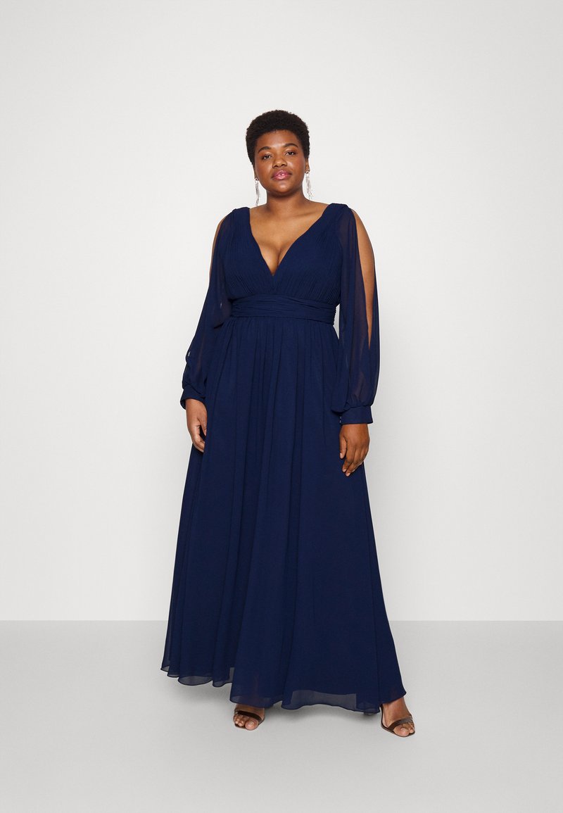 Navyblaues Maxikleid mit tiefem Ausschnitt, langen Ärmeln und tailliertem Bund. Hergestellt aus fließendem, leichtem Stoff mit durchsichtigen Akzenten.