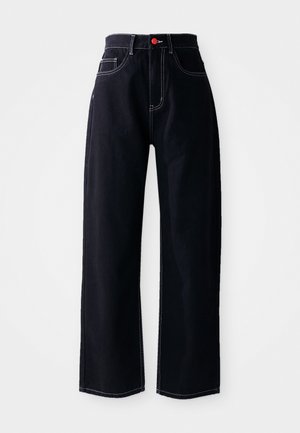 Black denim high-waisted pants with a straight-leg design. Features white stitching and a red button at the front. Smooth texture.