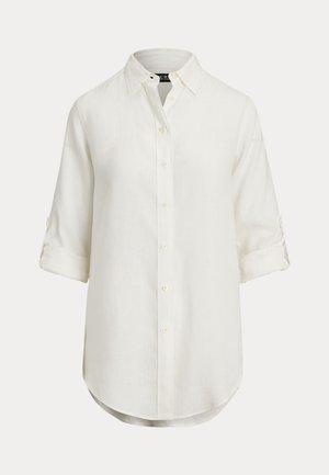 White linen shirt with a button-down design, long sleeves rolled up, curved hem, and a classic collar. Subtle texture, soft fabric.