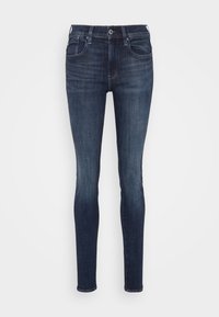 Mörkblå skinny jeans i denim med en klassisk femficksdesign och en dragkedja med knappstängning. Lätt urtvättade vid låren.