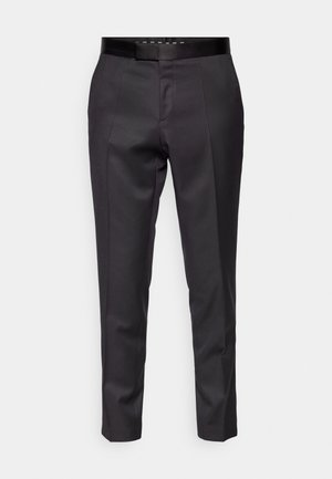 Tailored black trousers with a smooth texture, tapered legs, and a slim waistband. Features front pleats and a minimalist design.
