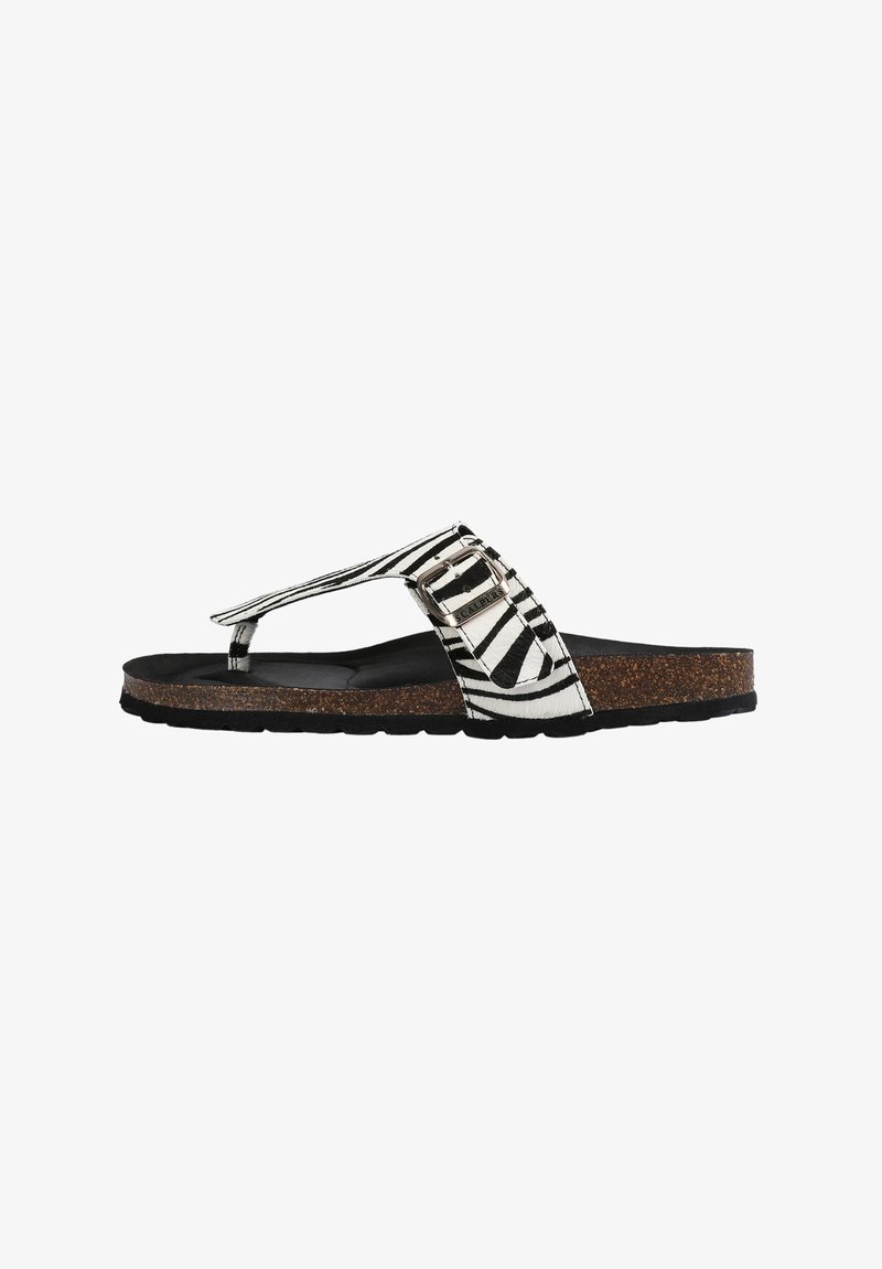 Svart- och vitrandig flip-flop sandal med en korkmellansula, gummiyttersula och en dekorativ spänne på remmen.