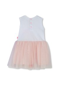 Witte mouwloze jurk met een roze tule rok. Voorzien van een knoopsluiting aan de achterkant met drie roze knopen, zachte stof en een subtiele glans in de tule.