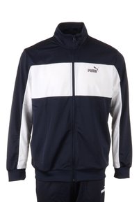 Giacca da track blu navy con striscia orizzontale bianca, colletto alto, zip frontale a tutta lunghezza e logo Puma sul lato sinistro del petto. Texture del tessuto liscia.
