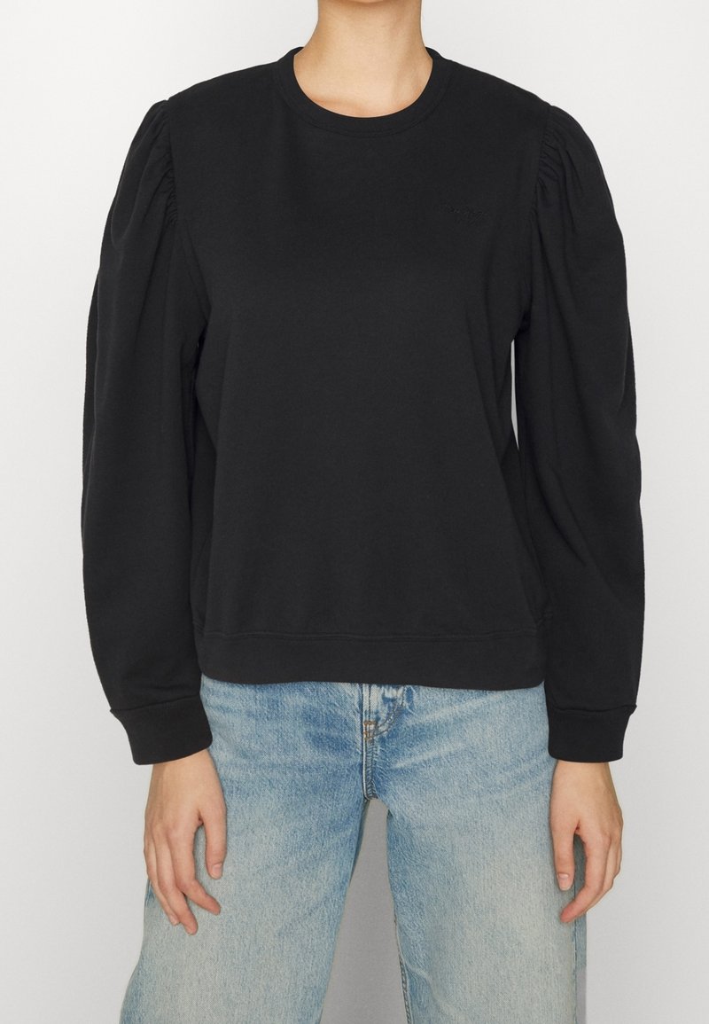 Sweat-shirt noir avec manches bouffantes, encolure ronde et poignets côtelés. Fabriqué en mélange de coton doux, avec un logo minimaliste sur la poitrine.