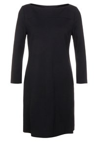 Robe noire à manches longues avec un décolleté carré, texture lisse, longueur au genou et détails de couture subtils sur le buste.