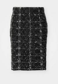 Jupe crayon en tweed noir et blanc avec une finition texturée, présentant un motif à carreaux et une coupe ajustée. Taille mi-haute, longueur genou.