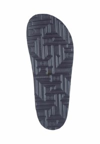 Schwarze Gummisohle mit strukturiertem Oberflächen, die ein geometrisches Muster und kreisförmige Akzente aufweist, konzipiert für Halt und Langlebigkeit.