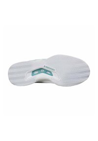 Sole di scarpa da tennis in gomma bianca con motivo a dritto e rovescio, caratterizzata da un accento teal e un tallone sagomato per stabilità.