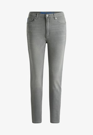 Grey denim jeans with a slim fit, five-pocket design, subtle whiskering details, and a metal button closure at the waist.