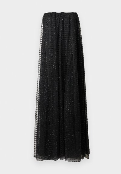 Long black sheer skirt with grid pattern of small embroidered crosses, gathered at the waist, hanging against a white background.