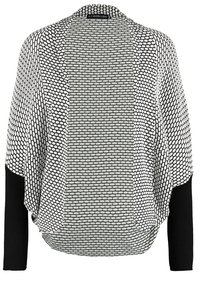 Cardigan noir et blanc ouvert sur l'avant avec motif nid d'abeille et manches longues unies noires contrastantes.