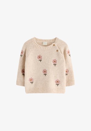 Beige strikket babytrøje med pink blomstermønstre og to træknapper nær den runde halsudskæring, med lange ærmer.