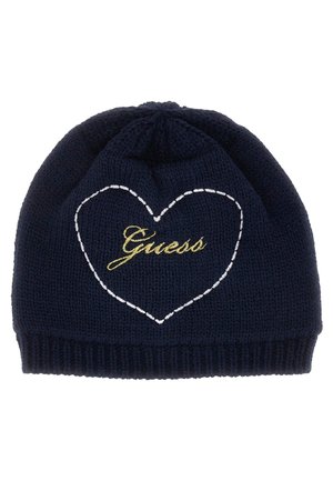 Tamsus megztas beretė su baltu siuvinėtu širdies kontūru ir auksiniu siuvinėjimu "Guess". Tekstūruota medžiaga su tvirtu, siaurėjančiu pritaikymu.