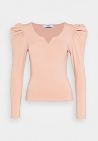 Naken långärmad topp med v-ringning och puffade axlar, tillverkad av mjukt, stretchigt material. Slät textur och figurnära silhuett.