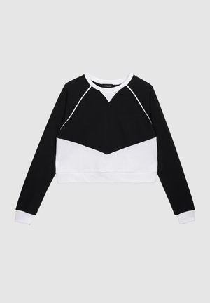 Skraťená mikina v čierno-bielej farbe s dizajnom v tvare V, dlhými rukávmi, rebrovanými manžetami a kontrastným prešívaním.