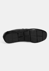 Zwarte rubberen schoenzool met een gestructureerd oppervlak, met een rasterpatroon en een ronde neus. Stevige, flexibele constructie voor comfort.