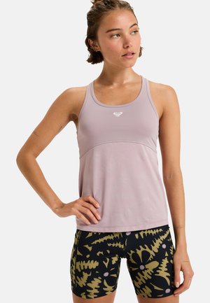Light purple athletic tank top with a logo, paired with black shorts featuring a green abstract leaf pattern, smooth texture throughout.