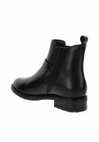 Stivale alla caviglia in pelle nera con zip laterale, tacco basso e impilato, punta rotonda e linguetta sul retro.
