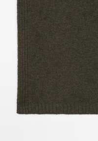 Dark green knitted fabric with a ribbed border. Features a smooth texture and consistent color. Edge shows neat stitching details.