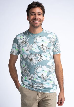 Bloemen T-shirt met korte mouwen, licht teal met witte en zwarte bloempatronen, ronde halslijn, zachte katoenstof, casual pasvorm.