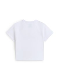 T-shirt blanc à manches courtes raglan et coupe courte. Fabriqué en tissu doux, il est doté d'un col rond et d'un design minimaliste.