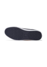 Navy sneaker sole with textured grip pattern, featuring a white rubber outlining. The design includes a logo in the center.