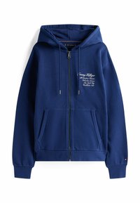 Felpa con zip blu navy dotata di tasca a marsupio, cappuccio regolabile con cordino, polsini a costine e logo ricamato sul petto. Tessuto morbido e strutturato.