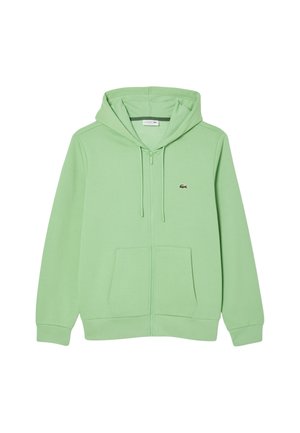 Grüner Baumwoll-Zip-Hoodie mit einer vorderen Tasche, Zugbändern und einem kleinen Logo auf der Brust. Glatte Textur und lockere Passform.