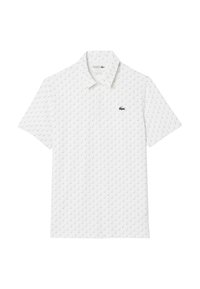 Polo shirt bianco realizzato in tessuto traspirante, con un motivo ripetitivo di segni di spunta verdi e un logo verde ricamato sul petto.