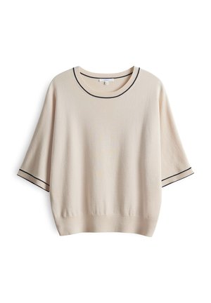 Pull beige à manches courtes avec bordure noire sur l'encolure ronde et les poignets des manches, ourlet en bas, présenté sur fond blanc.
