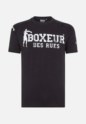 T-shirt in cotone nero con scollatura tonda, caratterizzato da testo stampato bianco "BOXEUR DES RUES" e una grafica silhouette sul davanti. Maniche corte.