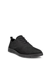 Chaussure décontractée homme en daim noir à lacets, semelle noire flexible et languette au talon, montrée en angle vers la droite sur fond blanc.