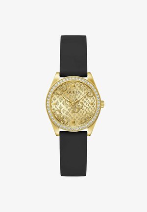 Arany tónusú óra részletes mintázatú számlappal, fekete szilikon szíjjal és kristálydíszítéssel a kerület körül. A quartz mechanizmussal rendelkezik.