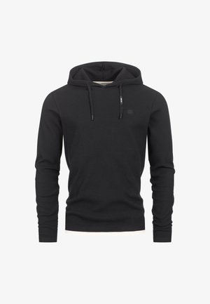 Felpa nera con cappuccio realizzata in tessuto a costine. Presenta un cordino, maniche lunghe e un piccolo logo sul petto. Vestibilità classica con fondo curvo.