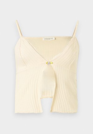 Kremasti rebrasti pleteni, bez rukava, kratki top s V-izrezom, čipkastom ukrasnom trakom, otvorom sprijeda i podesivim naramenicama.