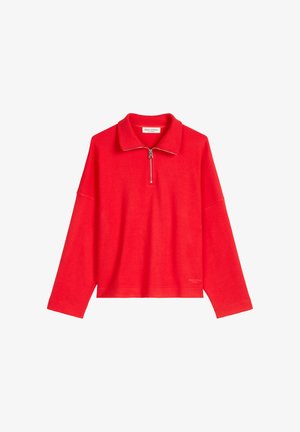 Czerwony pulower z kapturem z zamkiem błyskawicznym przy kołnierzu, szerokimi długimi rękawami i luźnym krojem. Wykonany z miękkiego materiału, posiada logo marki na lamówce.