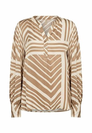 Lange mouwen blouse in lichtbeige met contrasterende bruine zigzagstrepen. Heeft een kraagloos ontwerp en een drieknoopsluiting. Glad stof.