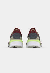 Athletic shoes in grey, maroon, and neon green with a textured mesh upper, padded heel counter, and white rubber outsole.
