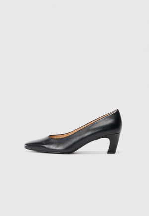 Black leather mid-heel pump with a pointed toe and curved block heel, shown in profile on a plain light gray background.