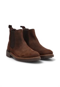 Botas Chelsea de cuero marrón con paneles laterales elásticos, tiradores y suela de goma texturada. Punta redondeada con detalles de costura mínimos.